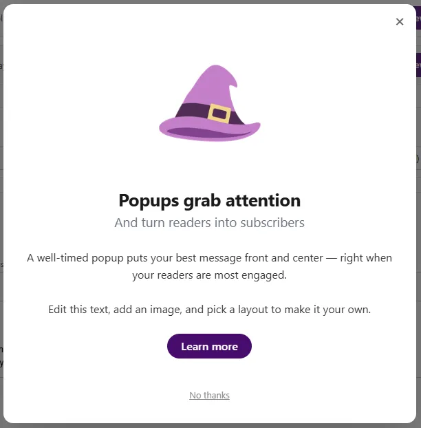 A centred call-to-action popup: a witch-hat illustration on top, a headline and two short paragraphs, a Learn more button and a No thanks link